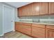 Storage room featuring many wood cabinets and drawers for ample storage space at 505 Lighthouse Ln, Peachtree City, GA 30269