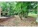 Spacious backyard featuring a patio with outdoor seating, grill, and a basketball hoop for outdoor fun at 135 Crimson Rdg, Tyrone, GA 30290