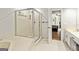 This bathroom features a soaking tub with a glass-enclosed shower and easy access to the bedroom at 135 Crimson Rdg, Tyrone, GA 30290
