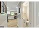 Neutral-toned bathroom with a sink and toilet, showcasing modern fixtures and a clean design at 135 Crimson Rdg, Tyrone, GA 30290