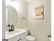 Cozy powder room featuring a vessel sink, modern fixtures, and elegant decor at 135 Crimson Rdg, Tyrone, GA 30290