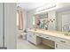 Bright bathroom featuring a large mirror, white cabinets, and a toilet, with a playful llama-themed shower curtain at 135 Crimson Rdg, Tyrone, GA 30290