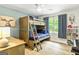 Bedroom featuring bunk beds, ceiling fan, and natural light at 135 Crimson Rdg, Tyrone, GA 30290