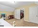 Attic bedroom featuring carpet floors and a walk-in closet, perfect for storage or conversion into a play area at 135 Crimson Rdg, Tyrone, GA 30290