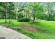 Charming two-story brick and siding home with mature landscaping and driveway at 135 Crimson Rdg, Tyrone, GA 30290