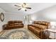 Living room featuring hardwood floors and neutral paint at 135 Crimson Rdg, Tyrone, GA 30290
