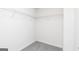 Walk-in closet with carpeted floor and shelving for optimal organization at 493 Prescott Way, Villa Rica, GA 30180