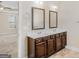 Bathroom vanity with double sinks, framed mirrors, and abundant storage at 1141 Abundance Dr, Locust Grove, GA 30248