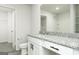Bright bathroom with granite countertop vanity, white cabinets and a view of the shower/tub at 481 Prescott Way, Villa Rica, GA 30180
