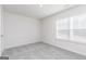 Bright, carpeted bedroom with natural light, clean walls, and double hung windows at 481 Prescott Way, Villa Rica, GA 30180