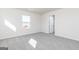 Bedroom with neutral carpet, white walls, a bright window, and white trim at 481 Prescott Way, Villa Rica, GA 30180