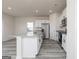 Kitchen featuring a white island with granite countertops, stainless steel appliances, and modern cabinets at 481 Prescott Way, Villa Rica, GA 30180