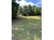 Backyard with a grassy hill and some trees at the top at 121 Fountain Oak, Villa Rica, GA 30180