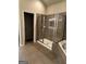 Well-appointed bathroom features a glass shower, tile flooring, and modern fixtures at 121 Fountain Oak, Villa Rica, GA 30180