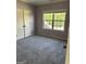 Cozy bedroom with neutral-tone walls, plush carpet, and a window at 121 Fountain Oak, Villa Rica, GA 30180