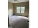 A comfortable bedroom features carpet, neutral walls, and a window at 121 Fountain Oak, Villa Rica, GA 30180