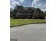 Inviting two-story home with a manicured lawn, traditional architectural details, and a welcoming front porch at 121 Fountain Oak, Villa Rica, GA 30180