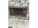 Fireplace featuring a modern gray stone surround and mantle at 121 Fountain Oak, Villa Rica, GA 30180
