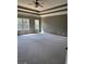 Spacious main bedroom boasts a tray ceiling, windows, and room for comfortable living at 121 Fountain Oak, Villa Rica, GA 30180