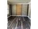 An empty room with paneled walls, trim, and hard wood floors at 121 Fountain Oak, Villa Rica, GA 30180