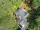 Stunning aerial view of home featuring mature trees and a private backyard at 120 Oak Shadow Way, Fayetteville, GA 30215