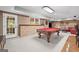 Finished basement featuring a pool table and stone accent wall at 120 Oak Shadow Way, Fayetteville, GA 30215