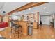 Basement bar with wooden bar top, seating, and stone backsplash at 120 Oak Shadow Way, Fayetteville, GA 30215