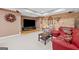 Finished basement with a tv, sitting area and brick accent wall at 120 Oak Shadow Way, Fayetteville, GA 30215