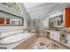 Luxurious bathroom with a large soaking tub, glass shower, and double vanity at 120 Oak Shadow Way, Fayetteville, GA 30215