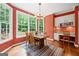 Dining room with ample natural light, hardwood floors, and a chandelier at 120 Oak Shadow Way, Fayetteville, GA 30215