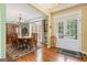 Formal dining room with hardwood floors, classic chandelier, china cabinet and french doors at 120 Oak Shadow Way, Fayetteville, GA 30215