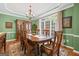 Traditional dining room featuring hardwood flooring, a large window and an ornate china cabinet at 120 Oak Shadow Way, Fayetteville, GA 30215