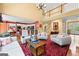 Bright living room featuring a chandelier, open kitchen, and second-floor balcony at 120 Oak Shadow Way, Fayetteville, GA 30215