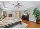 The main bedroom includes hardwood floors, tray ceilings, and a decorative rug at 120 Oak Shadow Way, Fayetteville, GA 30215