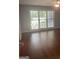 Relaxing bedroom featuring large windows and natural light at 3705 Sandhill Se Dr, Conyers, GA 30094