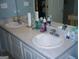 Bright bathroom with double sink vanity and a large mirror at 225 Long Creek Dr, Covington, GA 30016