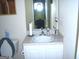 This bathroom features a standard sink and toilet at 225 Long Creek Dr, Covington, GA 30016