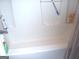 This bathtub features a shower, a showerhead, and a soap holder at 225 Long Creek Dr, Covington, GA 30016