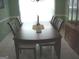 Dining room with tile floors and a dark wood table at 225 Long Creek Dr, Covington, GA 30016