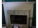 The fireplace features marble and white trim at 225 Long Creek Dr, Covington, GA 30016