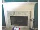 Elegant fireplace with marble surround, adding a touch of sophistication to the living space at 225 Long Creek Dr, Covington, GA 30016