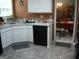 Kitchen with white cabinets and stainless steel sink at 225 Long Creek Dr, Covington, GA 30016