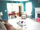 Bright living room with fireplace and large windows, perfect for relaxing and entertaining at 225 Long Creek Dr, Covington, GA 30016