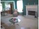 Spacious living room featuring a fireplace, dining area, and comfortable seating at 225 Long Creek Dr, Covington, GA 30016