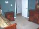 This main bedroom features a lovely ensuite, bedside tables and bed at 225 Long Creek Dr, Covington, GA 30016
