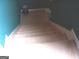 Carpeted staircase in a home's interior with a teal accent wall at 225 Long Creek Dr, Covington, GA 30016