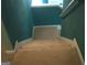 Carpeted stairs lead to the next level of this cozy home at 225 Long Creek Dr, Covington, GA 30016