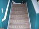 Stairs with tan carpet and white trim at 225 Long Creek Dr, Covington, GA 30016