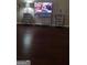 Comfortable living room with hardwood floors, TV, and side tables at 85 Bermuda Run Dr, Covington, GA 30016