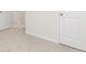 Carpeted hallway with white doors and neutral wall color at 295 Limestone Circle, Conyers, GA 30013